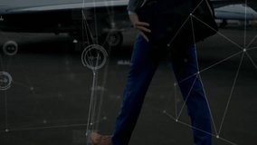 Business traveler striding beside private jet, initiating network graphics showing aviation data. Luxury, professionalism, travel, corporate, transportation, innovation, sophistication - Powered by Shutterstock - Get 15% off with code: PIKWIZARD15