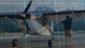 Pilot approaching high-wing plane on lakeside ramp inspecting strut and checking cockpit for safety. Aviation, adventure, outdoor, travel, scenic, exploration, safety - Powered by Shutterstock - Get 15% off with code: PIKWIZARD15