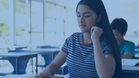 Teenage girl writing in classroom, causing profile icons linking into network overlay showing links. Education, technology, connectivity, youth, collaboration, innovation, communication - Powered by Shutterstock - Get 15% off with code: PIKWIZARD15