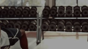 Male lifter gripping dumbbell initiating bench press for fitness tracking with graph overlays. Strength training, gym equipment, fitness, digital analytics, workout, athletic, exercise - Powered by Shutterstock - Get 15% off with code: PIKWIZARD15