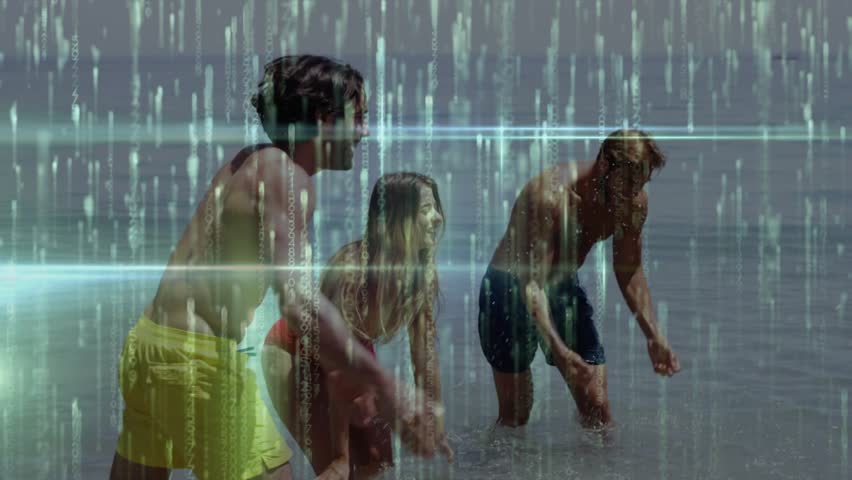 Friends scooping water and tossing splashes chasing woman in green bikini during beach recreation. Summer, playful, recreation, leisure, outdoor, vibrant, joyful