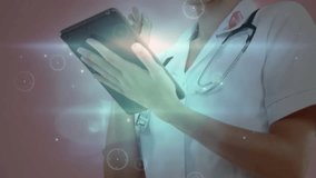 Female doctor tapping tablet and initiating animated network graphics for data exploration. Futuristic, technology, healthcare, interface, digital, innovation, professional - Powered by Shutterstock - Get 15% off with code: PIKWIZARD15