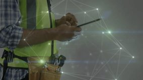 Site engineer tapping tablet and activating network overlay then putting on goggles and hard hat. Technology, security, connectivity, industrial, innovation, engineering, digital - Powered by Shutterstock - Get 15% off with code: PIKWIZARD15