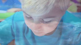 Student leaning with pencil writing on paper while network graphics highlight digital learning. Education, technology, innovation, creativity, connectivity, learning, classroom - Powered by Shutterstock - Get 15% off with code: PIKWIZARD15