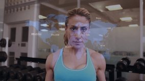Woman initiating dumbbell curl in gym, overlaying animated world map data tracking fitness stats. Fitness, strength, exercise, training, wellness, determination, athletic - Powered by Shutterstock - Get 15% off with code: PIKWIZARD15