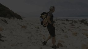 pole-using hiker advancing along rocky beach starting tech node network mapping overlaying scene. Adventure, exploration, technology, digital, connectivity, outdoor, innovation - Powered by Shutterstock - Get 15% off with code: PIKWIZARD15