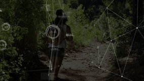 Hiker jogging forest trail activating digital mapping overlay and scanning terrain in tech demo. Adventure, nature, fitness, technology, exploration, outdoor, connectivity - Powered by Shutterstock - Get 15% off with code: PIKWIZARD15