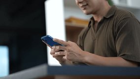 Businessman using mobile phone play social media in office - Powered by Shutterstock - Get 15% off with code: PIKWIZARD15