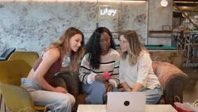 Three diverse women smiling, using a laptop and credit card for online shopping - Powered by Shutterstock - Get 15% off with code: PIKWIZARD15