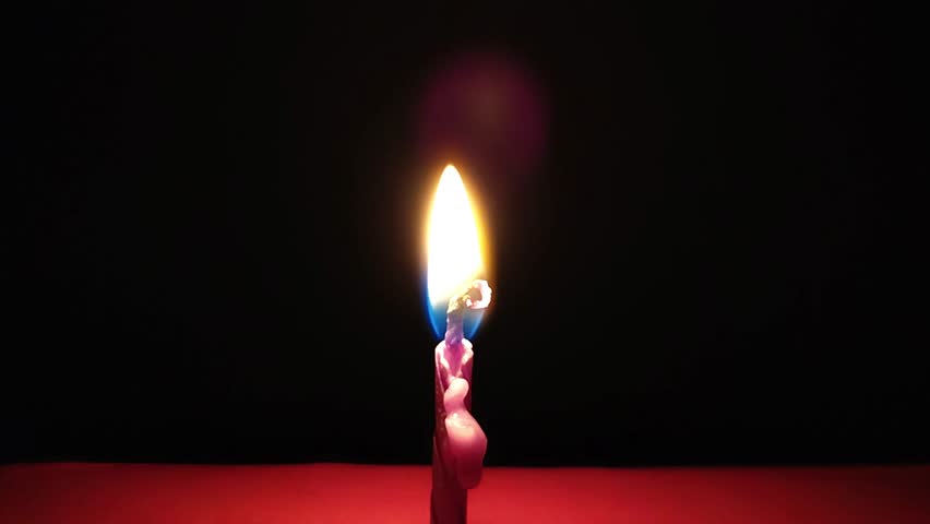 Pink candle burning on a red surface - Powered by Shutterstock - Get 15% off with code: PIKWIZARD15