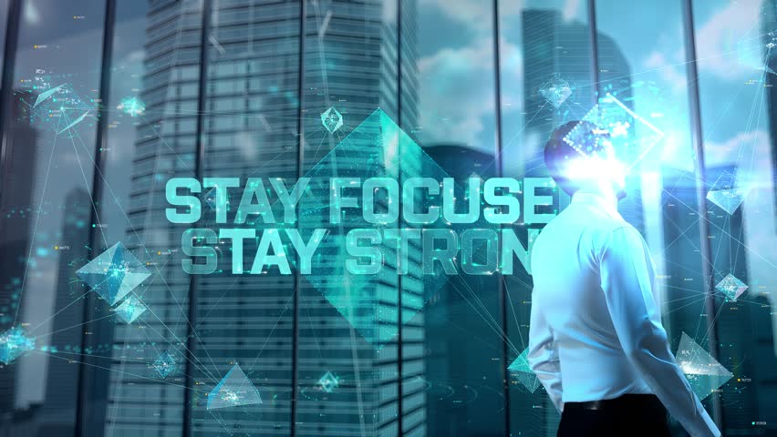 Stay Focused, Stay Strong. Businessman Working in Office among Skyscrapers. Hologram Concept