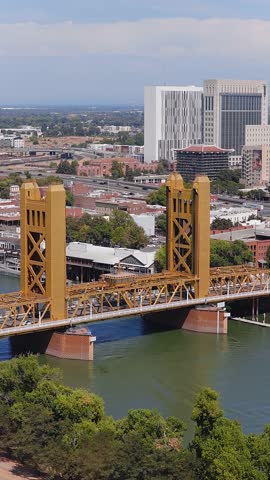 An aerial view of the Tower Bridge near State Capitol Building in Sacramento, California on a beautiful summer day over the Sacramento River.