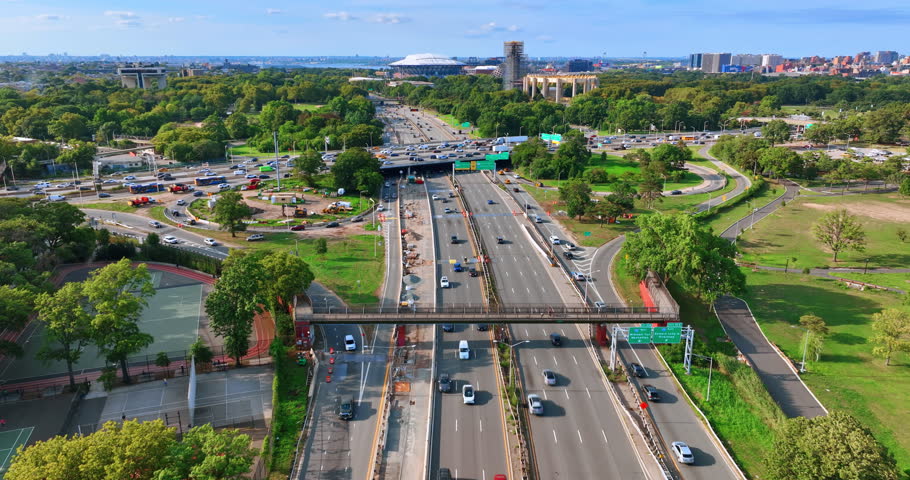 Crazy traffic on the roads at daytime. Drone footage over the highways of New York busy with cars.