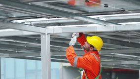 Solar cell, electricity alternative renewable clean energy industry, sustainability power technology. Male engineer installing solar panel and energy storage system on infrastructure building rooftop. - Powered by Shutterstock - Get 15% off with code: PIKWIZARD15