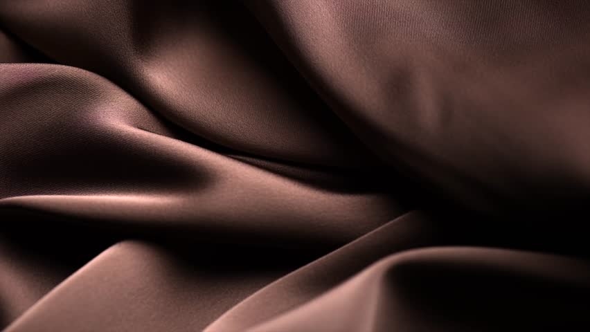 Chocolate brown color silk background, texture of beautiful dark chocolate satin fabric close-up. Abstract smooth backdrop. Rotating, slow motion 