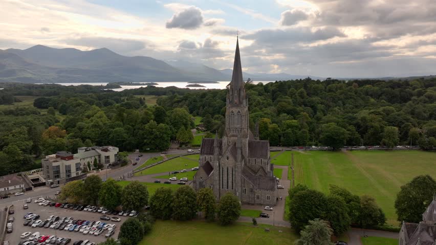 Killarney, Ireland, County Kerry - Aerial Drone Shot in Cloudy day of St. Mary Cathedral in Late Irish Summer