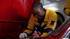 diverse team of Indian mechanic man and african american engineer woman collaborates on an engine inspection of a classic red car a garage car service . teamwork checkup in auto repair shop - Powered by Shutterstock - Get 15% off with code: PIKWIZARD15