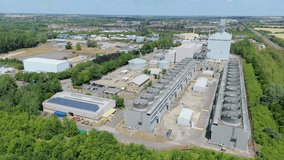 Drone Overhead of Coal  Gas Power Plant smoke stacks, cooling towers, turbines, transmission pylons, industrial energy facility
 - Powered by Shutterstock - Get 15% off with code: PIKWIZARD15