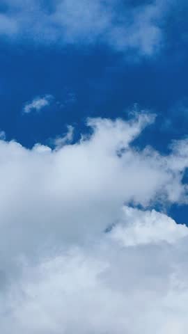 the movement of beautiful clouds in the bright blue sky.