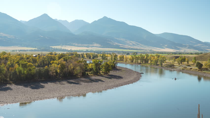 Morning light on Yellowstone River boats in Autumn colors