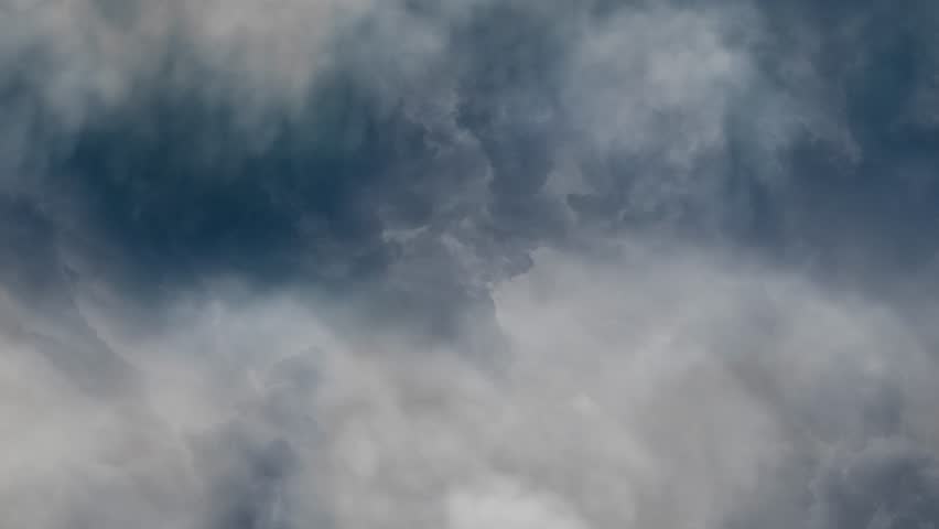 Dark Thunderstorm Clouds with Lightning Strikes in the Sky