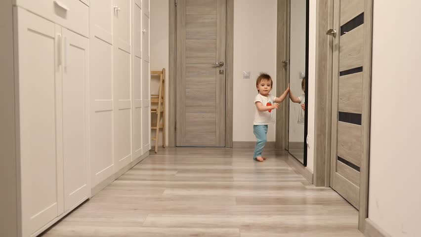 One-year-old girl - first steps