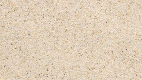 Ripples in clear beach water spreading across sand. One side captures the bubble impact, highlighting concentric rings and light refraction. Natural beauty in fluid motion - Powered by Shutterstock - Get 15% off with code: PIKWIZARD15