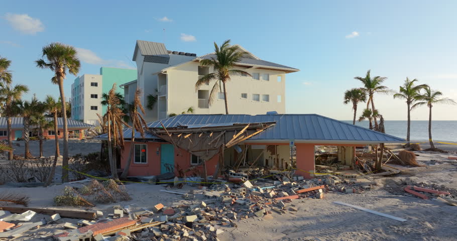 Storm surge severe damage to residential houses on ocean shore after hurricane landfall. Natural disaster consequences in Florida.
