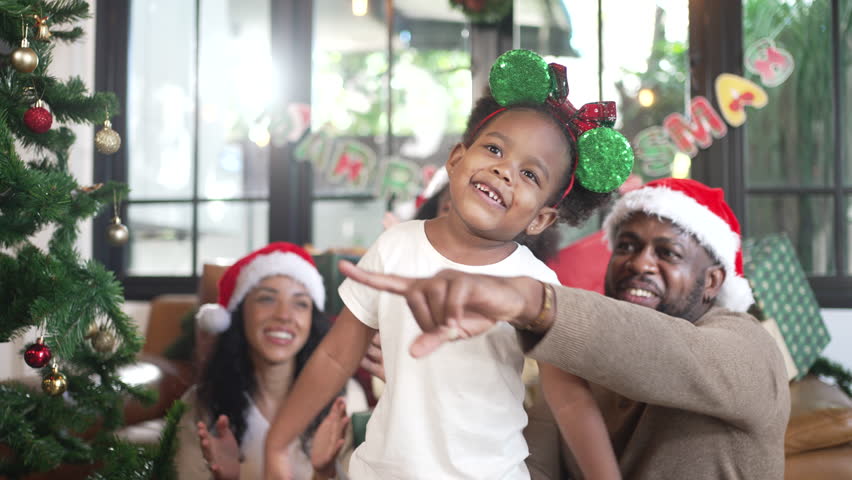 African family is celebrating for Christmas festival at home. Christmas, celebration.