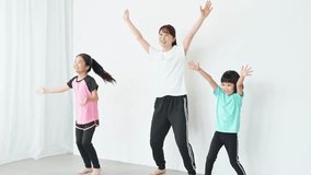 Children and a female trainer in a dance lesson - Powered by Shutterstock - Get 15% off with code: PIKWIZARD15