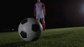 Soccer player shifting weight and preparing kick at ball with tech overlay appearing for analytics. Athletic, competition, digital, innovative, sports, stadium, motion - Powered by Shutterstock - Get 15% off with code: PIKWIZARD15