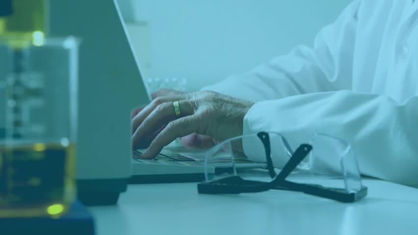 Senior scientist typing on laptop in lab and initiating floating data charts while studying visuals. Research, innovation, data, analysis, technology, science, visualization - Powered by Shutterstock - Get 15% off with code: PIKWIZARD15