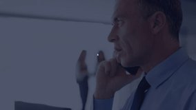 Mature male pausing smartphone call and visualizing expanding tech network of globe and chart icons. Technology, connectivity, innovation, communication, corporate, data, digital - Powered by Shutterstock - Get 15% off with code: PIKWIZARD15