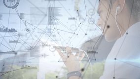 Adult male raising smartphone tapping screen with technology overlay pulsing analyzing data. Technology, connectivity, communication, innovation, digital, data, urban - Powered by Shutterstock - Get 15% off with code: PIKWIZARD15