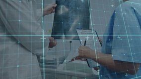 Senior physician manipulating radiograph while pointing area and guiding nurse noting insurance. Medical, teamwork, collaboration, healthcare, diagnostics, professional, clinical - Powered by Shutterstock - Get 15% off with code: PIKWIZARD15