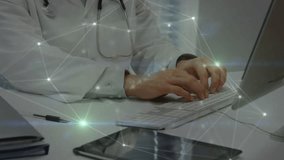 Doctor placing hands on keyboard activating network overlay and entering health data in portal. Health, technology, innovation, healthcare, digital, profession, data - Powered by Shutterstock - Get 15% off with code: PIKWIZARD15