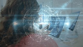 Mature woman watching telehealth monitor while doctor gesturing at holographic sphere materializing. Technology, healthcare, innovation, virtual, digital, telemedicine, futuristic - Powered by Shutterstock - Get 15% off with code: PIKWIZARD15