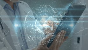 Senior male doctor tapping tablet and analyzing holographic medical data globe confirming insight. Medical technology, telemedicine, digital healthcare, innovation, futuristic, data visualization, - Powered by Shutterstock - Get 15% off with code: PIKWIZARD15