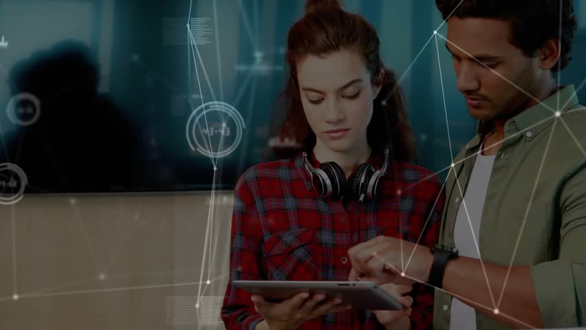 Coworkers tapping tablet interface and swiping screen, unveiling animated business data graphs. Collaboration, technology, digital, analytics, teamwork, innovation, business - Powered by Shutterstock - Get 15% off with code: PIKWIZARD15