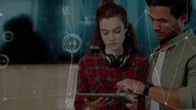 Coworkers tapping tablet interface and swiping screen, unveiling animated business data graphs. Collaboration, technology, digital, analytics, teamwork, innovation, business - Powered by Shutterstock - Get 15% off with code: PIKWIZARD15