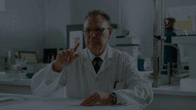 Senior scientist lifting finger on lab bench causing code overlay forming around torso for analysis. Research, innovation, futuristic, technology, data, artificial intelligence, experimentation - Powered by Shutterstock - Get 15% off with code: PIKWIZARD15