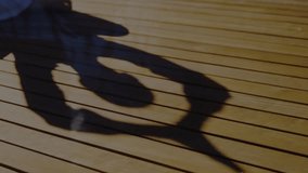 Seated woman tapping smartphone on sunlit deck with digital binary code visualizing data around her. Silhouette, technology, outdoor, minimalism, innovation, communication, digital - Powered by Shutterstock - Get 15% off with code: PIKWIZARD15