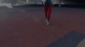 Female runner jogging on plaza showing blue overlay stretching leg and tracking fitness. Fitness, wearable, technology, athletic, health, motion, modern - Powered by Shutterstock - Get 15% off with code: PIKWIZARD15