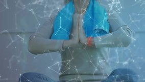 Senior woman bringing hands initiating healthtech WiFi phone icons syncing with mudra meditation. Meditation, mindfulness, digital, connectivity, wellness, relaxation, serenity - Powered by Shutterstock - Get 15% off with code: PIKWIZARD15