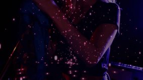 Performer gripping microphone triggers glowing particle overlay while singing on stage for music. Performance, vocalist, stage, lighting, digital art, entertainment, vibrant - Powered by Shutterstock - Get 15% off with code: PIKWIZARD15