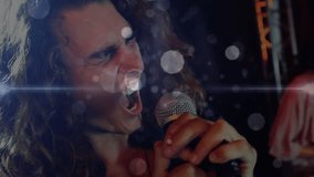 Vocalist gripping mic and delivering vocals, swaying under lens flares driving music collaboration. Performance, music, stage, entertainment, atmosphere, emotion, dynamism - Powered by Shutterstock - Get 15% off with code: PIKWIZARD15