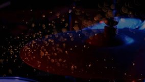 Drumstick striking hi-hat cymbal sending droplets scattering downward in light showing fluid motion. Music, rhythm, percussion, performance, artistry, vibrancy, atmosphere - Powered by Shutterstock - Get 15% off with code: PIKWIZARD15