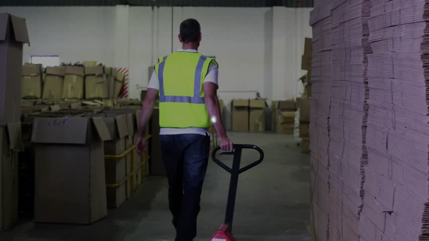 Warehouse worker pulling pallet jack down aisle initiating network overlay visualizing logistics. Industrial, logistics, digital, technology, manufacturing, automation, supply chain - Powered by Shutterstock - Get 15% off with code: PIKWIZARD15