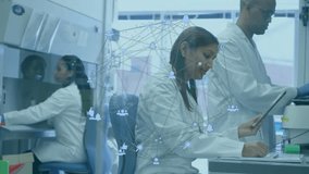 Lab scientists reviewing tablet data and writing notes while network intensifying over test tubes. Biotechnology, collaboration, innovation, scientific, technology, research, laboratory - Powered by Shutterstock - Get 15% off with code: PIKWIZARD15