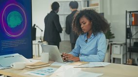 Focused business professional working in coworking space with AI assistance, virtual agent, big data analysis, laptop display screen, modern office technology, innovation, digital transformation - Powered by Shutterstock - Get 15% off with code: PIKWIZARD15